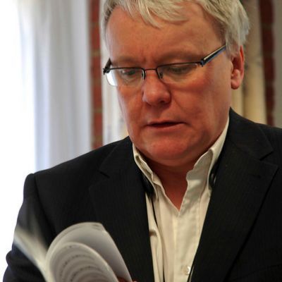Jeffery Wilson in a white shirt and black jacket